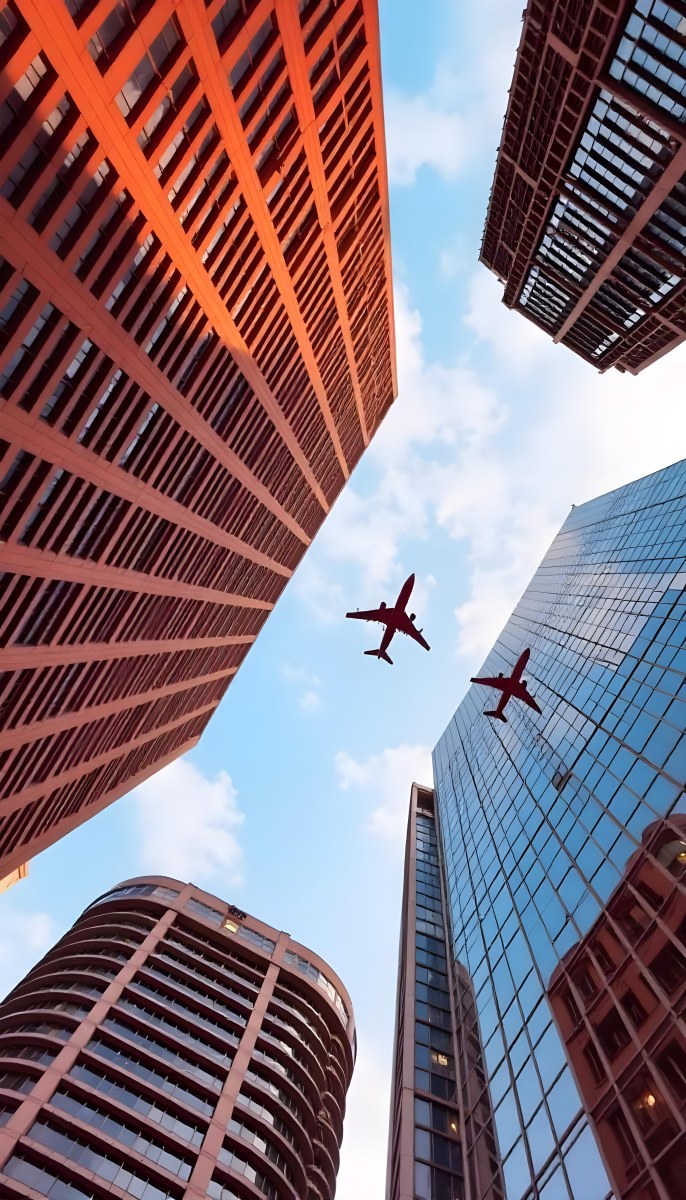 Two Airplanes Flying Between Skyscrapers Low Angle Shot Clear Sky Urban Environment City Landscape Commercial Aviation Modern Architecture Travel Concept 3 D934