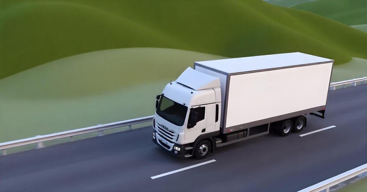 White Truck On The Road With A Green Container Green Hills In The Background Sunny Day Commercial Transport Highway 46 484f