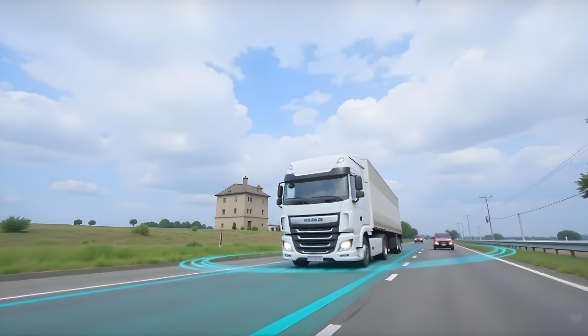 White Truck On The Road With Blue Lines Green Grass On The Left Cloudy Sky Some Cars In The Distance 2 8057