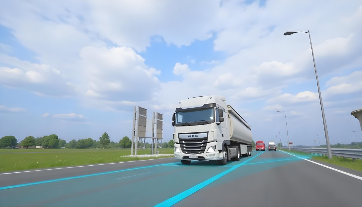 White Truck On The Road With Blue Lines Green Grass On The Left Cloudy Sky Some Cars In The Distance 8 777e