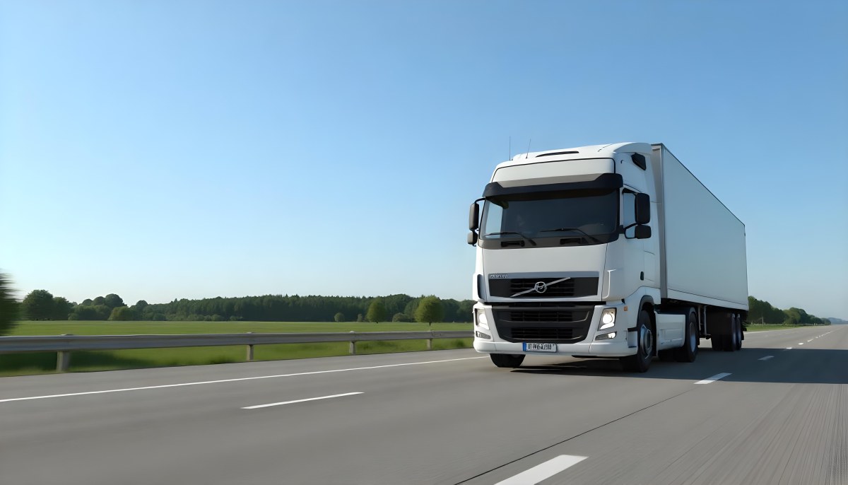 White Volvo Truck On The Highway Green Grass And Trees In The Background Clear Blue Sky Sunny Day Highway 8 D9e8