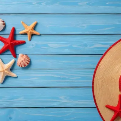 A Red Starfish Seashells And A Straw Hat On A Blue Wooden Background Summer Vacation Concept Beach Theme Top View Flat Lay 4 E606