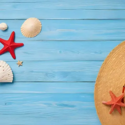 A Red Starfish Seashells And A Straw Hat On A Blue Wooden Background Summer Vacation Concept Beach Theme Top View Flat Lay 8 F727