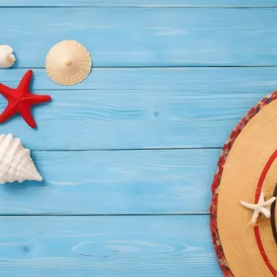 A Red Starfish Seashells And A Straw Hat On A Blue Wooden Background Summer Vacation Concept Beach Theme Top View Flat Lay 9 93bd