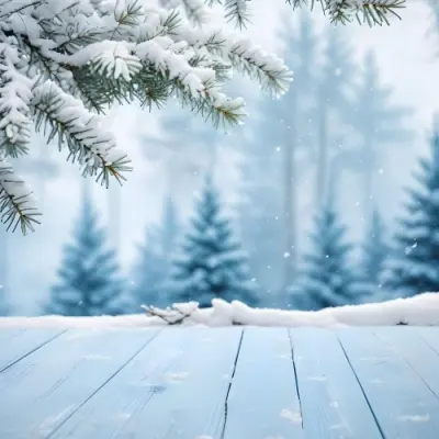 A Snowy Fir Branch On A Blue Wooden Table With A Blurred Background Of A Winter Forest And Falling Snow 23 Ccda