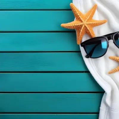 A Starfish And Sunglasses On A White Towel On A White Wooden Surface Beach Vacation Concept Summer Vacation Tropical Bright Colors High Angle View 4 B1a4