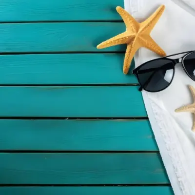 A Starfish And Sunglasses On A White Towel On A White Wooden Surface Beach Vacation Concept Summer Vacation Tropical Bright Colors High Angle View 7 22c9