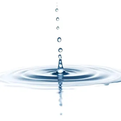 A Water Drop Falling Into A Body Of Water Creating Ripples Isolated On A White Background Studio Shot High Speed Photography 11 385a