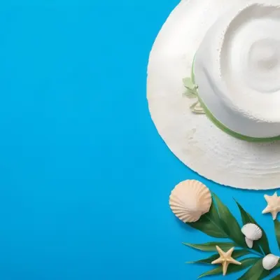 A White Hat A Seashell A Starfish And A Green Leaf On A Green Background 10 354c