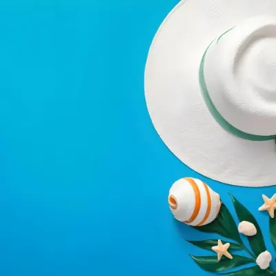 A White Hat A Seashell A Starfish And A Green Leaf On A Green Background 21 9e10