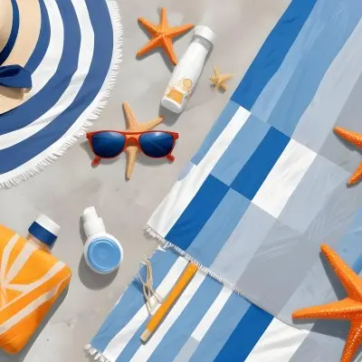 A Beach Towel With Blue Stripes A Straw Hat With Sunglasses A Sunscreen Bottle And Some Starfish On A Gray Marble Background 1 460b