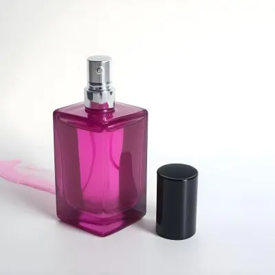 A Black Perfume Bottle With A Pink Sprayer And A Pink Cap On A White Surface Product Photography Studio Lighting Clean Background 3 E526