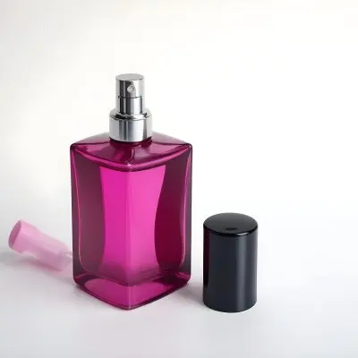 A Black Perfume Bottle With A Pink Sprayer And A Pink Cap On A White Surface Product Photography Studio Lighting Clean Background 48 C406