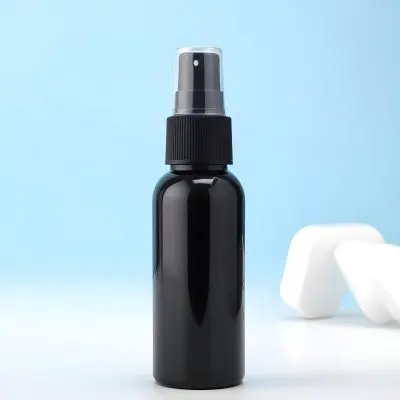 A Black Spray Bottle On A Light Blue Background 10 92cf