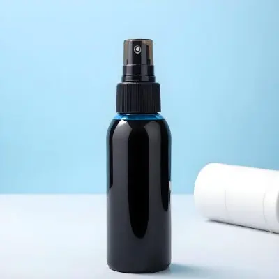 A Black Spray Bottle With A White Towel On A Light Blue Background 2 1d7c