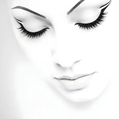A Black Young Woman Age 22 With Closed Eyes Long Eyelashes And White Eyeliner In A Black Background 11 A17b