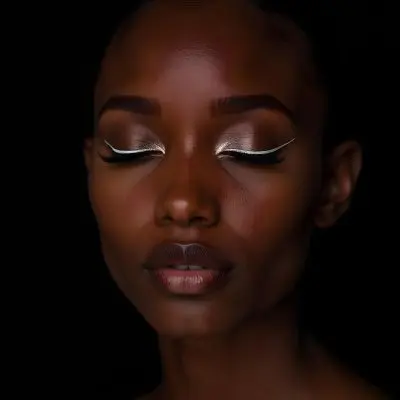 A Black Young Woman Age 22 With Closed Eyes Long Eyelashes And White Eyeliner In A Black Background 28 4e31