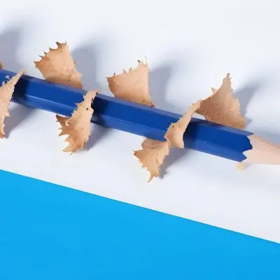 A Blue Pencil With Shavings On A White And Blue Background Close Up Shot Studio Photography 12 5434 C8bb