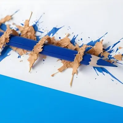 A Blue Pencil With Shavings On A White And Blue Background Close Up Shot Studio Photography 23 C9ac F5e2