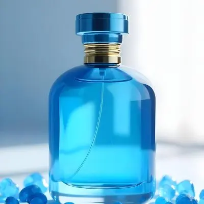 A Blue Perfume Bottle With A Blue Neck And A Golden Cap Surrounded By Small Blue Crystals In A Bright Studio 16 5d89