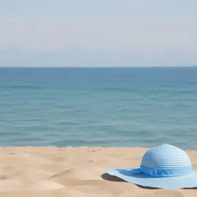 A Blue Sun Hat And Blue Sunglasses On A Sandy Beach With A Blue Sea And Sky In The Background 23 E6b2