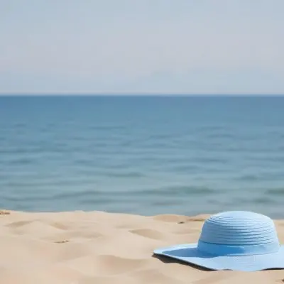 A Blue Sun Hat And Blue Sunglasses On A Sandy Beach With A Blue Sea And Sky In The Background 25 7ae3