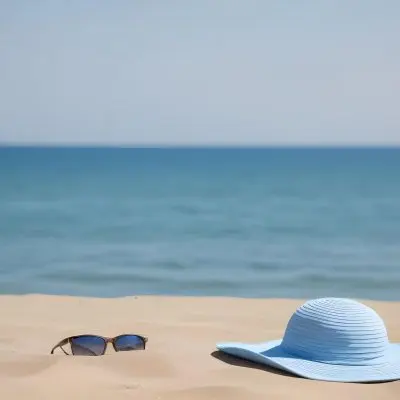 A Blue Sun Hat And Blue Sunglasses On A Sandy Beach With A Blue Sea And Sky In The Background 27 2213