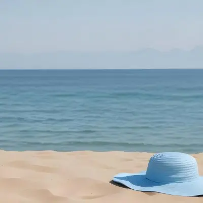 A Blue Sun Hat And Blue Sunglasses On A Sandy Beach With A Blue Sea And Sky In The Background 7 5973