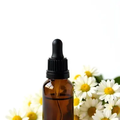 A Bottle Of Yellow Liquid Surrounded By White Daisy Flowers On A Light Background 7 40e9