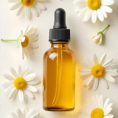 A Bottle Of Yellow Liquid Surrounded By White Daisy Flowers On A Light Background 8 1445