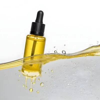 A Bottle Of Yellow Liquid With A Dropper Inside A Transparent Liquid With Bubbles White Background 40 E0da