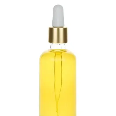 A Bottle With Yellow Oil And A Golden Dropper With A White Cap On A White Background 1 1b60