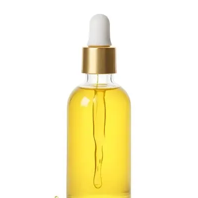 A Bottle With Yellow Oil And A Golden Dropper With A White Cap On A White Background 14 339b