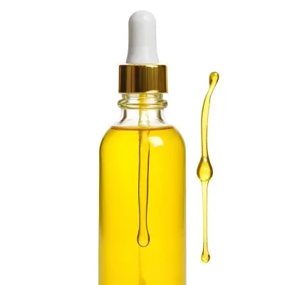 A Bottle With Yellow Oil And A Golden Dropper With A White Cap On A White Background 7 787c