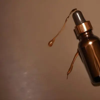 A Brown Glass Bottle With A Dropper On A Background Of Brown Hair The Hair Is Wavy And Shiny The Bottle Is In The Upper Right Corner 23 A6cd