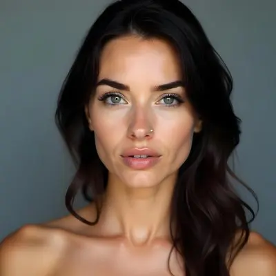 A Caucasian Woman 25 Years Old Dark Hair Nude Shoulders Wearing Makeup In A Grey Background 6 3f49
