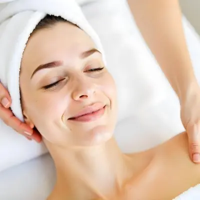 A Caucasian Woman Age 23 With A Towel On Her Head Receiving A Facial Treatment With A Towel In A Spa 7 68d9