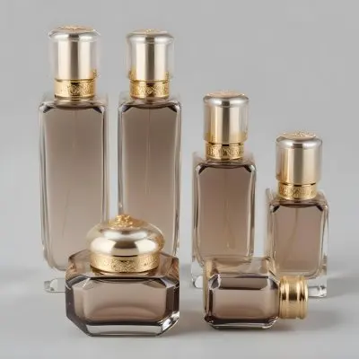 A Collection Of Luxury Glass Perfume Bottles With Gold Colored Caps And Accents Arranged On A Gray Background 28 37cf
