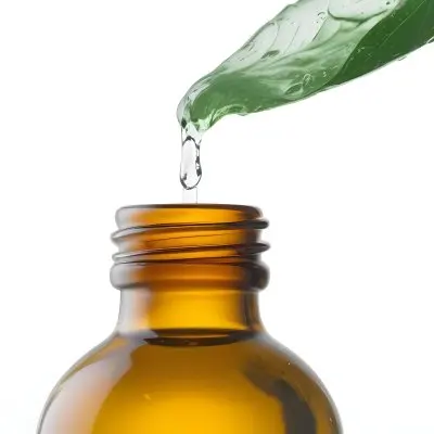 A Drop Of Water Falling From A Green Leaf Into A Green Glass Bottle White Background 20 0704