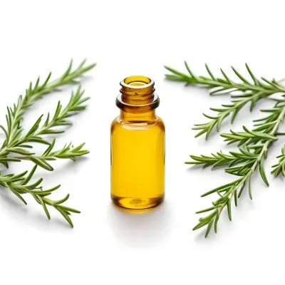 A Glass Bottle Filled With Yellow Essential Oil Surrounded By Sprigs Of Rosemary On A White Background 46 49f3