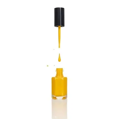 A Golden Nail Polish Bottle With A Drop Falling Into It And The Brush Above It On A White Background 20 4c90