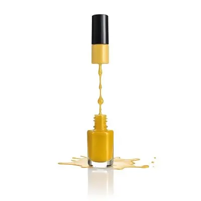 A Golden Nail Polish Bottle With A Drop Falling Into It And The Brush Above It On A White Background 21 6539