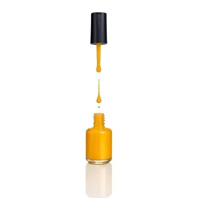 A Golden Nail Polish Bottle With A Drop Falling Into It And The Brush Above It On A White Background 33 6ae6