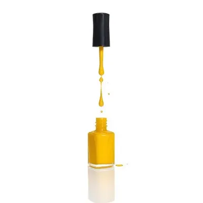 A Golden Nail Polish Bottle With A Drop Falling Into It And The Brush Above It On A White Background 35 48f8