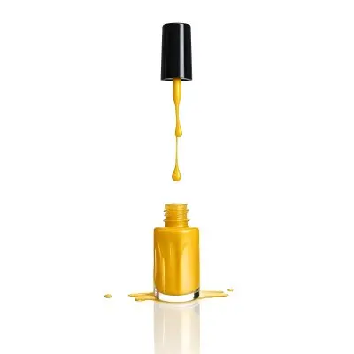 A Golden Nail Polish Bottle With A Drop Falling Into It And The Brush Above It On A White Background 39 12b2
