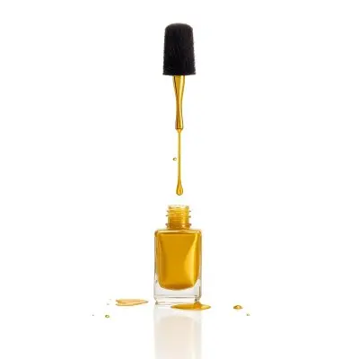 A Golden Nail Polish Bottle With A Drop Falling Into It And The Brush Above It On A White Background 4 D1d3