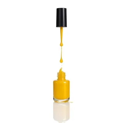 A Golden Nail Polish Bottle With A Drop Falling Into It And The Brush Above It On A White Background 44 950d