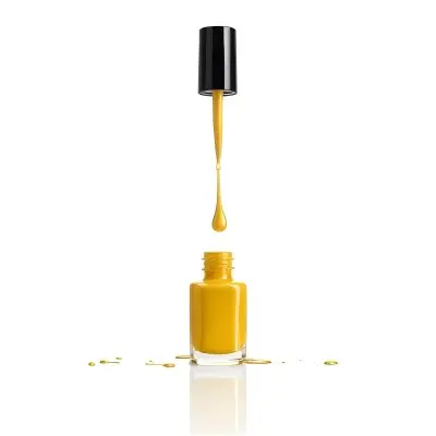 A Golden Nail Polish Bottle With A Drop Falling Into It And The Brush Above It On A White Background 51 D1cf
