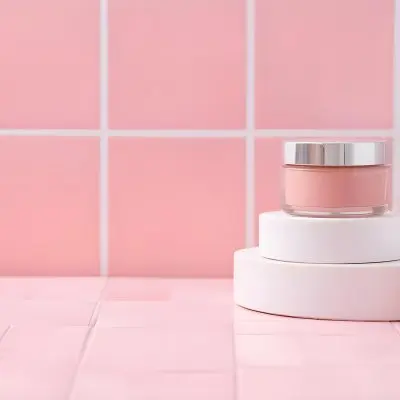 A Jar Of Makeup On Top Of Three White Platforms In A Pink Tiled Bathroom The Background Is Pink Tiles And The Floor Is White 17 C358