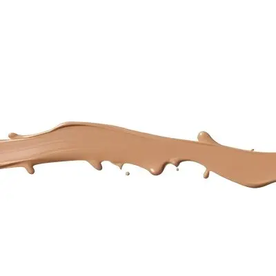 A Line Of Light Brown Liquid Foundation Isolated On A White Background With A Smooth And Slightly Glossy Texture Used For Cosmetics 30 C149